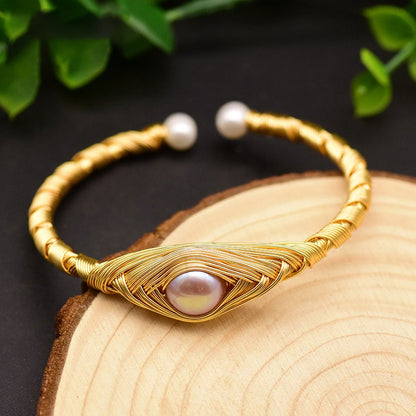This beautiful Eye of Pearl Adjustable Bangle Bracelet is suitable for any occasion and will add pizzazz to any wardrobe. Adjust easily to fit your wrist as needed. Gift yourself, your friends and family, this beautiful piece.