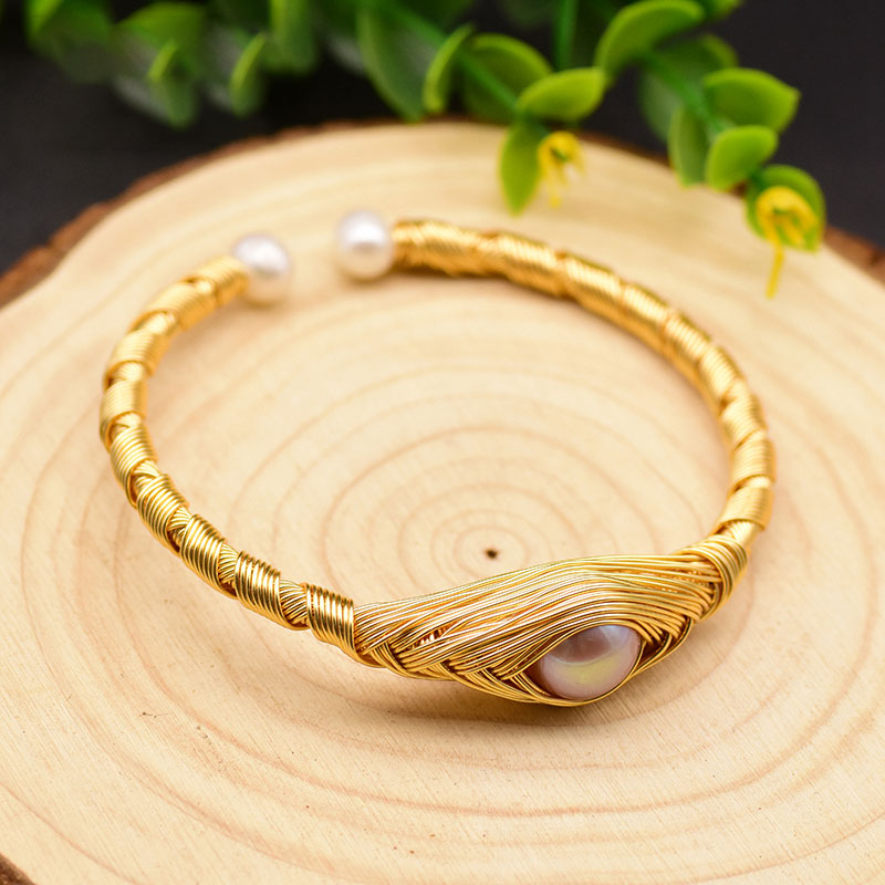 This beautiful Eye of Pearl Adjustable Bangle Bracelet is suitable for any occasion and will add pizzazz to any wardrobe. Adjust easily to fit your wrist as needed. Gift yourself, your friends and family, this beautiful piece.